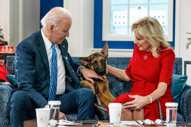 US President Joe Biden, his wife Jill Biden, and their German Shepherd Commander, at the White House on December 25, 2021.
