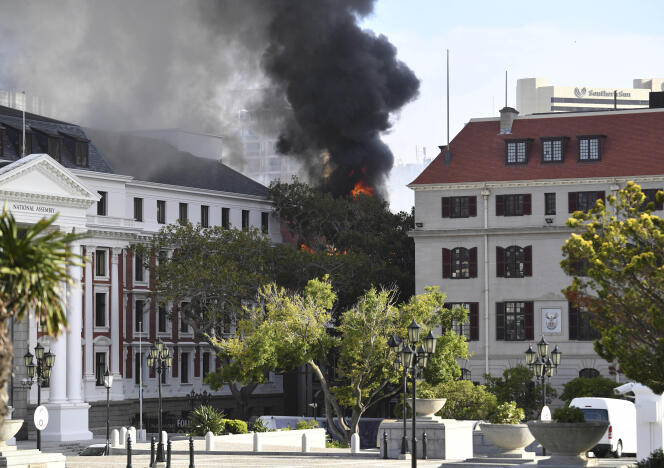 A fire ravages Parliament in Cape Town, South Africa on Sunday, January 2, 2022. South Africa's Minister of Public Works and Infrastructure said the fire broke out on the third floor of a building housing offices and spread to the National Assembly building, where the South African Parliament sits.