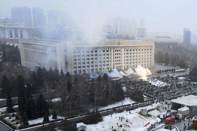 Smoke rises from the front of the Almaty Townhall on January 5, 2022.