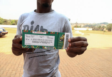 A general view of a ticket for a match of the Africa Cup of Nations (CAN) in Yaounde on January 6, 2022. - A Covid-19 vaccine is one of the keys to being able to go to the stadium and cheer on the Cameroonian team, the host country of the African Cup of Nations (CAN) of soccer.
Many Cameroonians are overcoming their reluctance to be vaccinated, one of the two conditions to attend the games, in addition to a negative PCR test of less than 72 hours or antigenic test of 24 hours. (Photo by Daniel Beloumou Olomo / AFP)