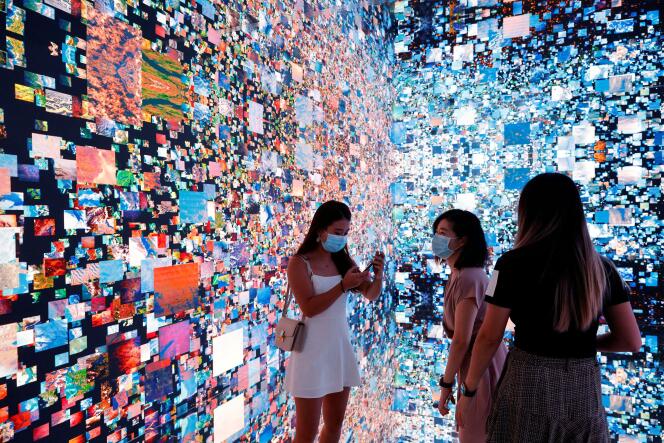 Visitors immersed in “Machine Hallucinations – Space: Metaverse”, by Refik Anadol, in Hong Kong, recently.