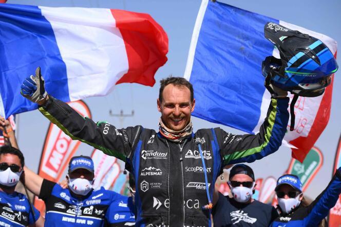 French quad rider Alexander Giroud celebrates his win of Dakar 2022 at the end of the last stage between Bisha and Jeddah in Saudi Arabia, on January 14, 2022. (Photo by FRANCK FIFE / AFP)