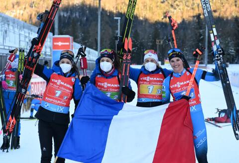 France's team celebrates winning the women's 4x6km relay event at the IBU Biathlon World Cup in Ruhpolding, southern Germany, on January 14, 2022. (Photo by CHRISTOF STACHE / AFP)