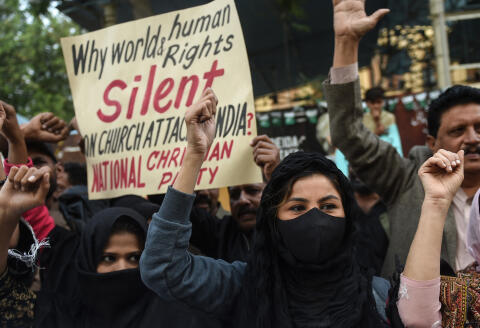 Christian devotees shout anti-India slogans during a protest against the latest attacks on Christians in India, in Karachi on January 2, 2022. (Photo by Rizwan TABASSUM / AFP)