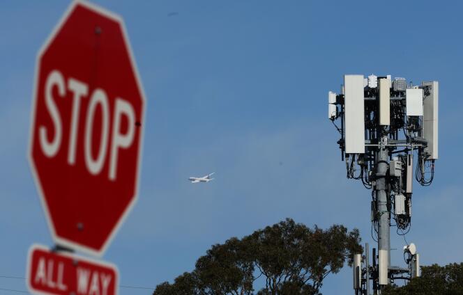 A plane takes off near a base station located near San Francisco International Airport (California), January 18, 2022.