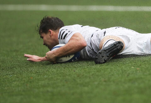 Toulouse's French scrum-half Antoine Dupont dives and scores his team's third try during the European Rugby Champions Cup first round, Pool B, rugby union match between Cardiff Rugby and Stade Toulousain at Cardiff Arms Park in Cardiff, south Wales, on December 11, 2021. (Photo by Geoff Caddick / AFP)