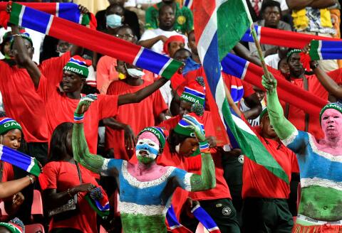 Gambia supporters cheer prior to the Group F Africa Cup of Nations (CAN) 2021 football match between Gambia and Tunisia at Limbe Omnisport Stadium in Limbe on January 20, 2022. (Photo by Issouf SANOGO / AFP)