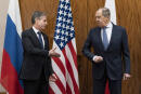 US Secretary of State Antony Blinken, left, greets Russian Foreign Minister Sergey Lavrov before their meeting, in Geneva, Switzerland, Friday, Jan. 21, 2022. (AP Photo/Alex Brandon, Pool)