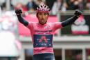 (FILES) In this file photo taken on May 24, 2021, wverall leader Team Ineos rider Colombia's Egan Bernal celebrates as he crosses the finish line to win the 16th stage of the Giro d'Italia 2021 cycling race, 153km between Sacile and Cortina d'Ampezzo in Italy. Former Tour de France winner Egan Bernal was "conscious" and "stable" in hospital following a training accident near his home town in Colombia, his cycling team Ineos Grenadiers said on Monday January 24, 2022. (Photo by Luca BETTINI / AFP)