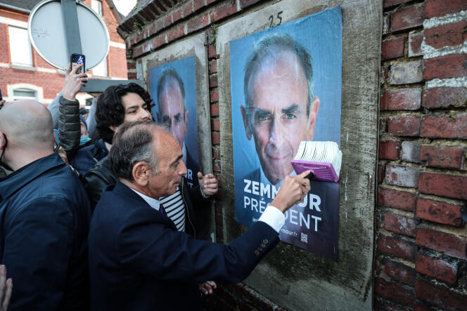 Les Hauts de France on January 14, 2022. Eric Zemmour, candidate for Reconquête! far-right party in the 2022 French presidential election, hangs a campaign poster in Honnecourt sur Escaut.