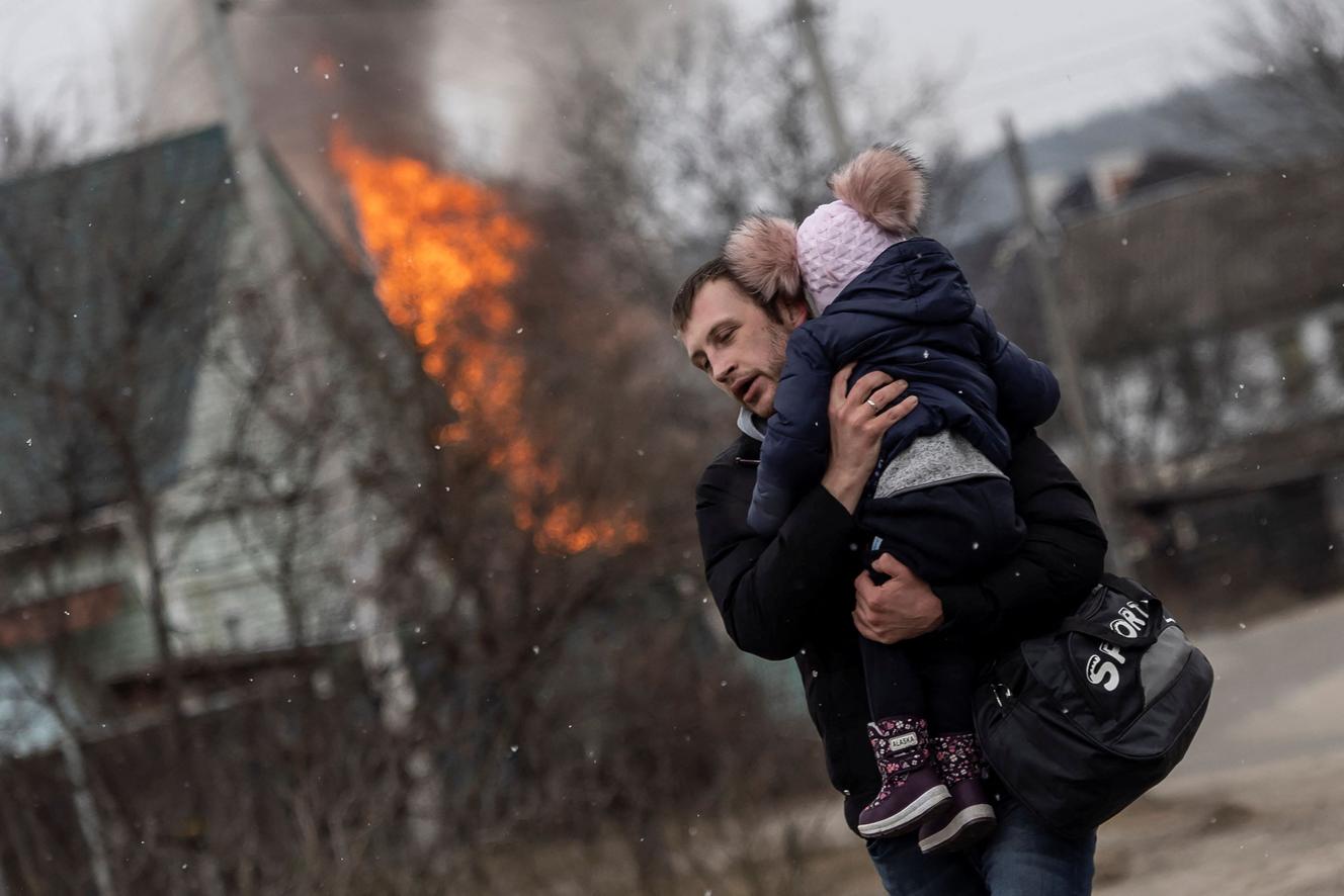 On March 6, 2022, in the city of Irbin near Kiev in Ukraine, a boy and a girl escaped from the city of Irbine after a heavy shelling of the only escape route used by residents as Russian troops advanced towards the capital Kiev.