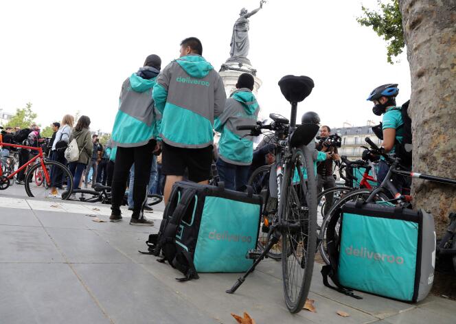 In this file photo taken on August 11, 2017 Bike delivery people from the Deliveroo food delivery service demonstrate at Place de la Republique in Paris. The trial of Deliveroo and three of its ex-managers for concealed work is held in Paris on March 9. 