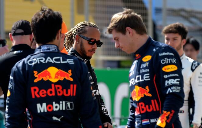 Lewis Hamilton (centre) meets rival Max Verstappen (right) on March 12, during the pre-season test at Bahrain Circuit.