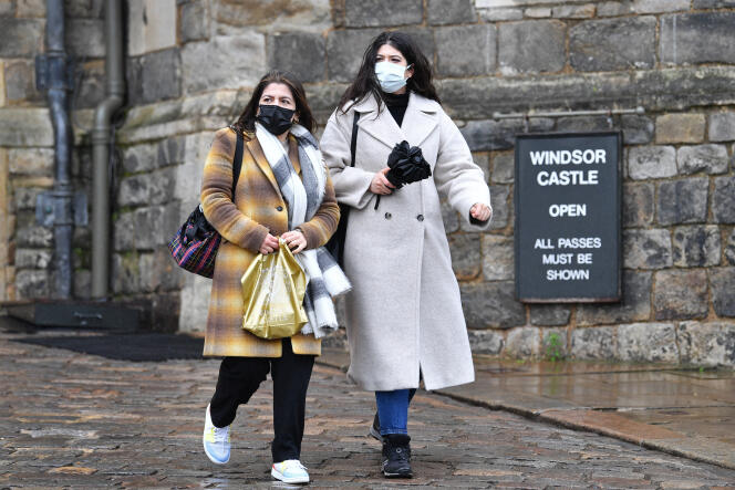 People wear face masks in Windsor on February 20, 2022.