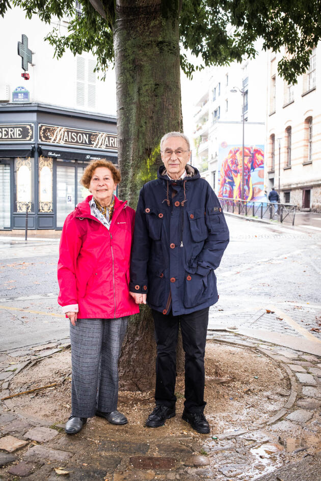 Henriette Bagès and her husband, Charles, under the hackberry tree on Place Henri-Krasucki in Paris on September 15, 2021. She grew up above the bakery in the background.