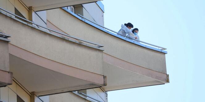 Police examine the balcony from which a French family of five appears to have jumped, in Montreux, Switzerland March 24, 2022. 
