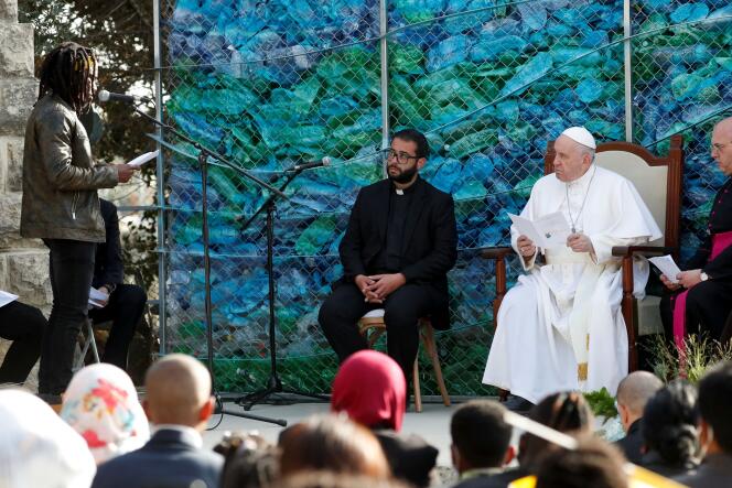 Pope Francis listens to the testimony of a man who arrived illegally in Europe after crossing the Mediterranean Sea, at the John XXIII Peace Laboratory, in Hal Far, on the island of Malta, on April 3, 2022.