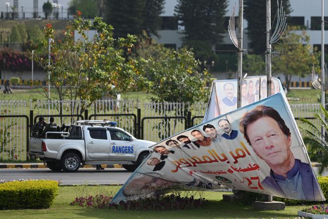 Security guards patrol the parliament building in Islamabad on April 3, 2022.