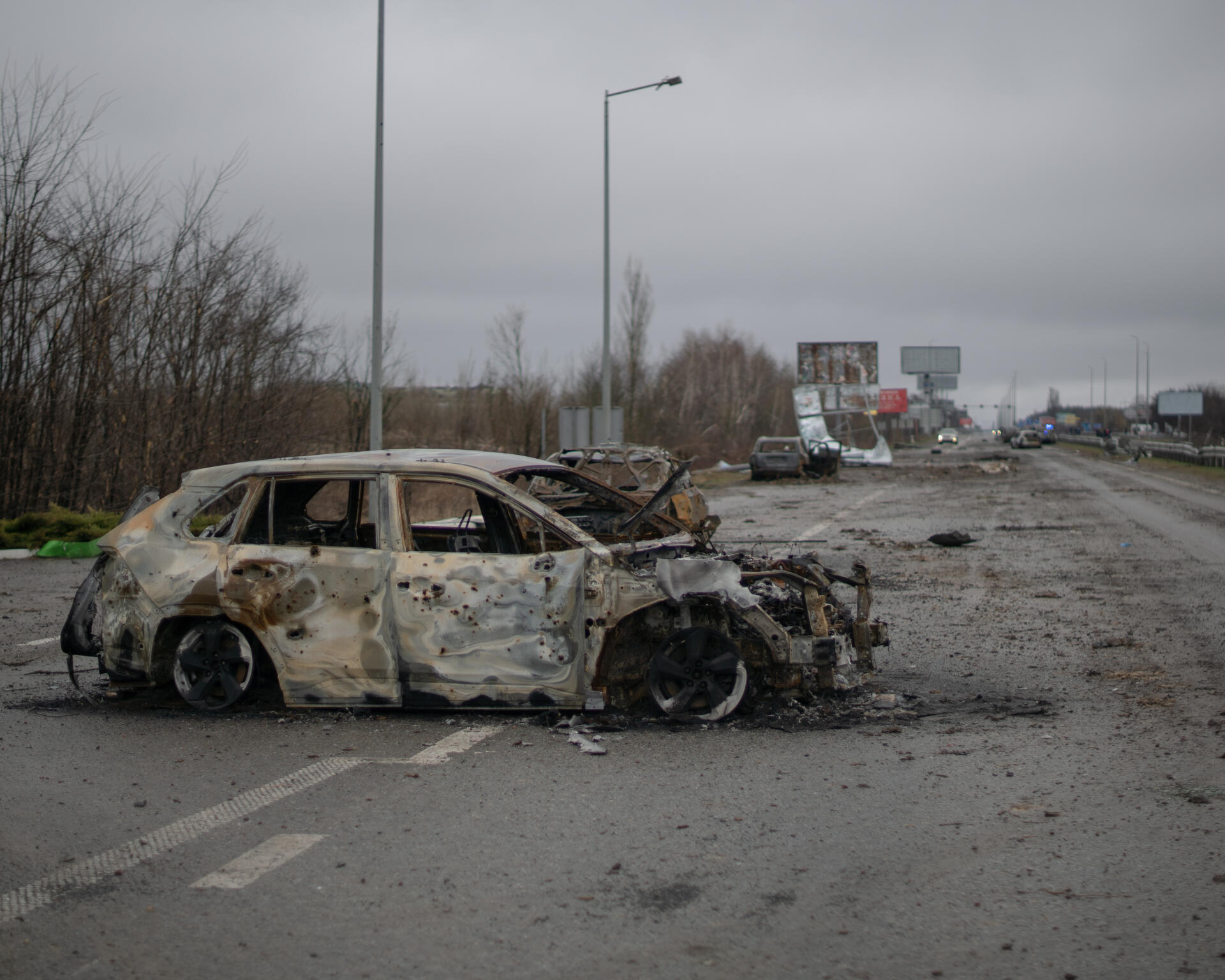 Burnt cars, targets of attacks by the Russian army on the E40 highway connecting Kiev to Zhytomyr.  Ukraine, April 2.