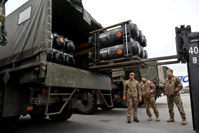 In this February 11, 2022 photo, Ukrainian soldiers load a truck with Javelin missiles after it has been delivered to Boryspil Airport near Kyiv.