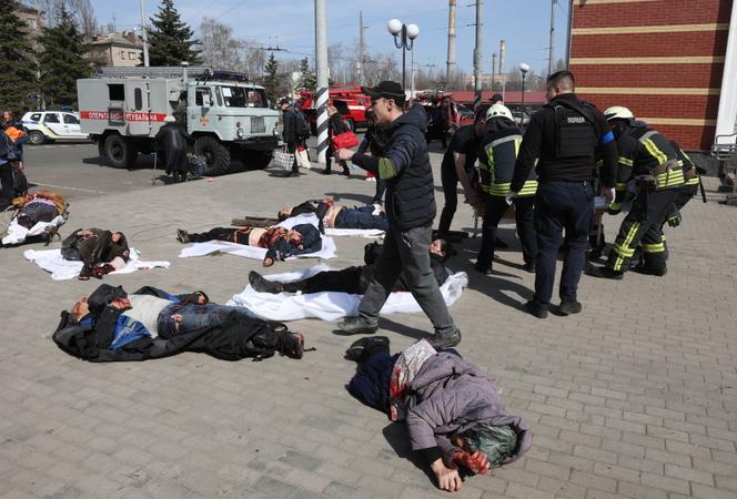 Rescuers attend to the injured in a strike at the Kramatorsk train station in Donbass, Ukraine, April 8, 2022.