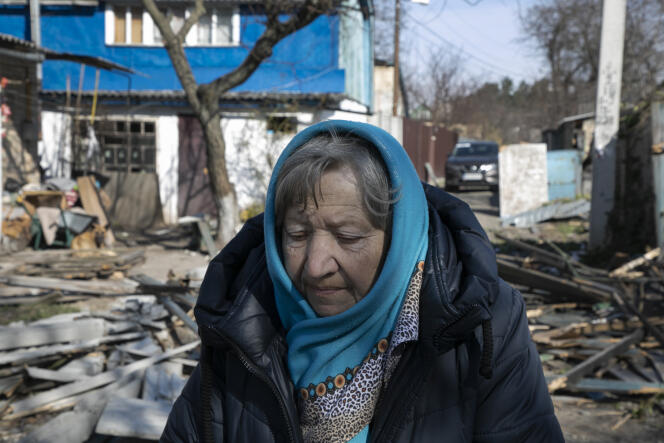 Natalya in front of Irina Gavriluk's house, whose husband Serhiy and brother Roman were killed.