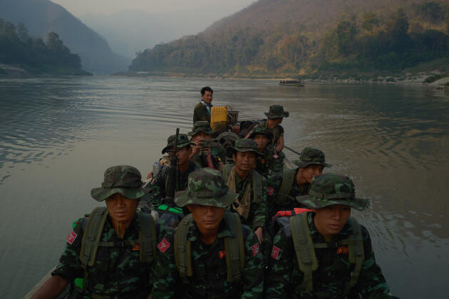 Soldiers of the Karenni Army, the long-standing guerrilla movement, cross the Salween River to a camp near the Thai border on February 24, 2022.