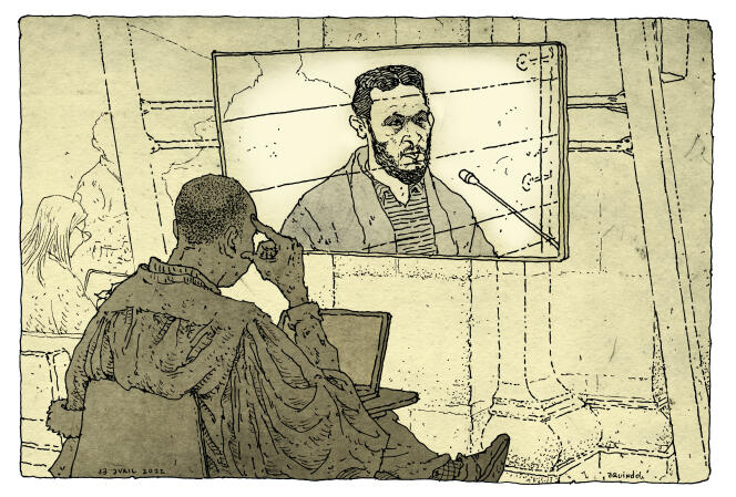 Salah Abdeslam on screen in the courtroom during the November 13 trial at the Special Court in Paris, April 13, 2022.