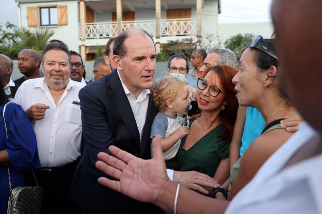 French Prime Minister Jean Castex speaks with members of the public in Saint-Pierre, on the French Indian Ocean island of Réunion, on April 14, 2022, during a one-day visit to campaign for French President Emmanuel Macron. 