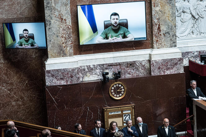 Ukraine's President Volodymyr Zelensky speaks via video conference before the National Assembly in Paris on March 23, 2022.