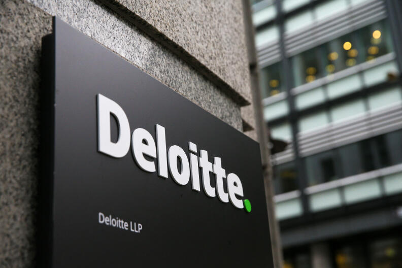 A Deloitte logo is pictured on a sign outside the company's offices in London on September 25, 2017. - Deloitte said Monday that "very few" of the accounting and consultancy firm's clients were affected by a hack after a news report said systems of blue-chip clients had been breached. (Photo by Daniel LEAL / AFP)