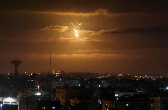 A missile from Israel's Iron Dome air defense system lights up the sky in the central Gaza Strip on April 21, 2022.