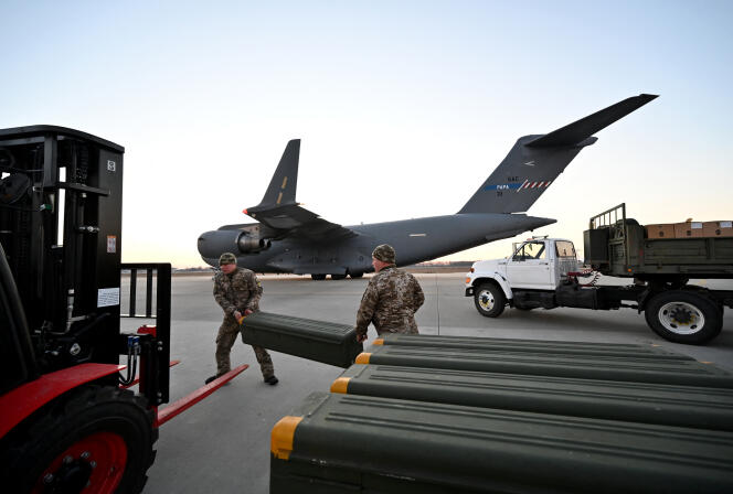 Ukrainian soldiers unload a shipment of Stinger missiles from Lithuania at Boryspil airport near Kyiv on February 13, 2022. 