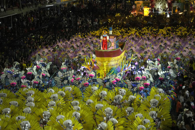 Performers from the Sao Clemente samba school parade on a float during Carnival celebrations in Rio, April 23, 2022.