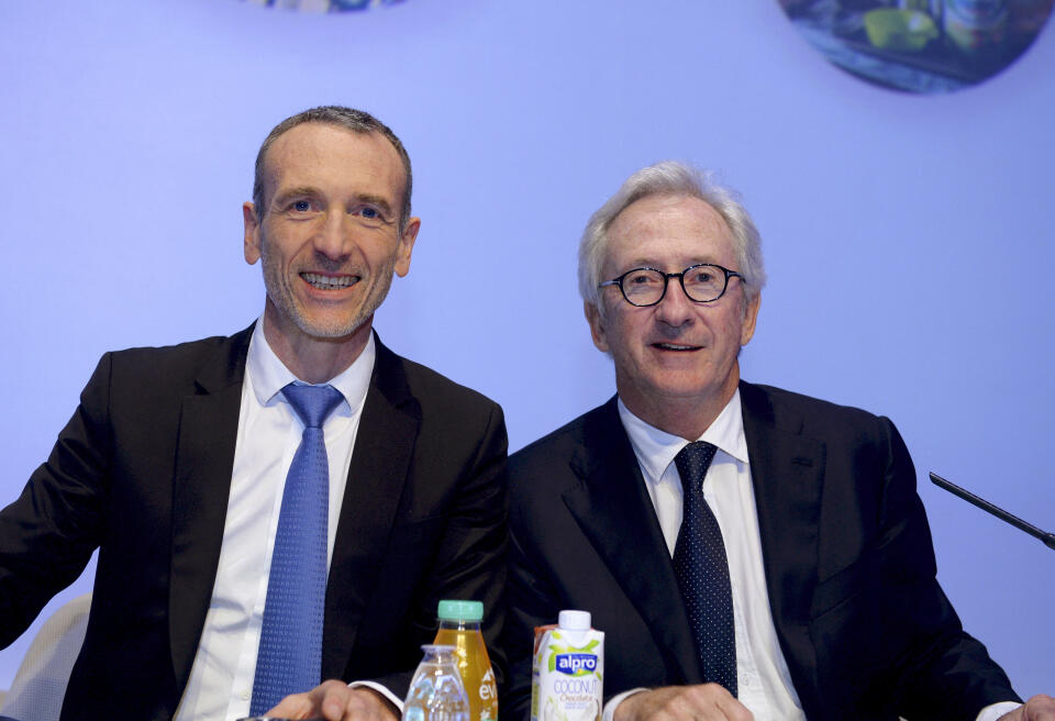 French food group Danone CEO Emmanuel Faber (L) and board chairman Franck Riboud (R) pose for a photograph prior to the start of the group's general meeting in Paris on April 27, 2017. (Photo by ERIC PIERMONT / AFP)