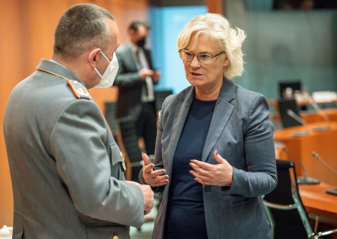 German Defense Minister Christine Lambrecht talks with Bundeswehr General Carsten Breuer in Berlin on April 27, 2022.