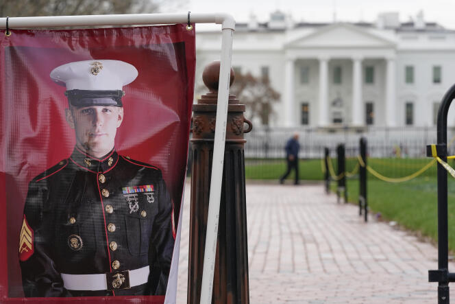 A poster photo of U.S. Marine Corps veteran and Russian prisoner Trevor Reed stands in Lafayette Park near the White House, March 30, 2022, in Washington.