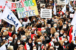 People take part in a demonstration called by French magistrate, lawyers and Justice workers unions outside the Economy and Finance ministry in Paris on December 15, 2021, to demand more resources for the Justice. (Photo by Alain JOCARD / AFP)