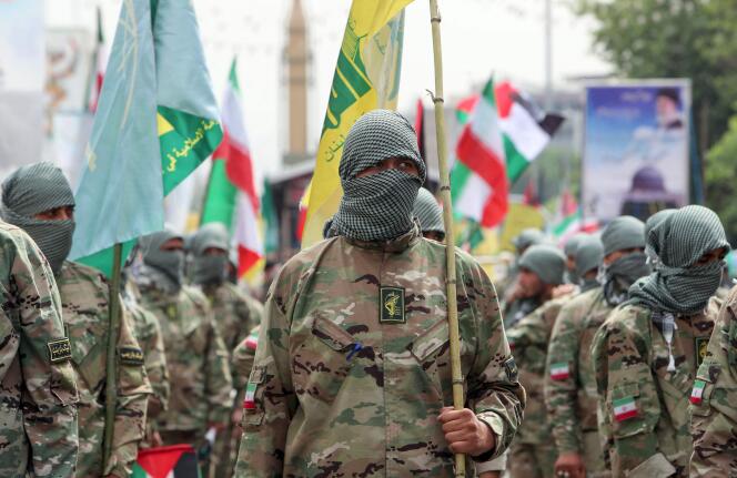 Iranian paramilitary forces take part in a Quds Day rally in Tehran on April 29, 2022.