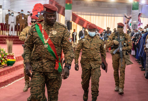 Lieutenant-Colonel Paul-Henri Sandaogo Damiba, President of Burkina Faso, leaves his inauguration ceremony after being invested President of Transition, in Ouagadougou, on March 2, 2022. - After being sworn in on February 16 before the Constitutional Council of Burkina Faso, Lieutenant-Colonel Paul-Henri Sandaogo Damiba, author of a coup d'etat on January 24, was again invested as president on Wednesday, the day after the adoption of a transition charter. (Photo by OLYMPIA DE MAISMONT / AFP)