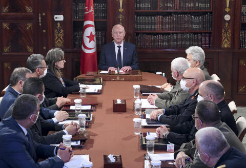 A handout picture provided by the Tunisian Presidency Press Service shows Tunisian President Kais Saied chairing the National Security Council on March 30, 2022 at the Carthage Palace. - Saied dissolved the country's parliament and said MPs would be prosecuted, extending an eight-month power grab and intensifying the country's political crisis. (Photo by TUNISIAN PRESIDENCY / AFP) / === RESTRICTED TO EDITORIAL USE - MANDATORY CREDIT "AFP PHOTO / HO / PRESIDENCY PRESS SERVICE " - NO MARKETING NO ADVERTISING CAMPAIGNS - DISTRIBUTED AS A SERVICE TO CLIENTS ===