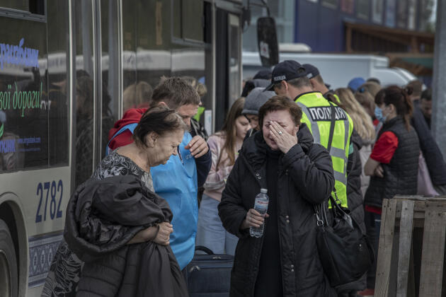Civilians who stayed for weeks in the Azovstal iron and steel plant in Mariupol arrive by bus in Zaporizhzhia, Ukraine, on Tuesday, May 3, 2022.