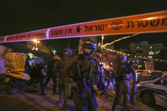Israeli forces secure the area of a stabbing attack in the town of Elad, Israel, Thursday, May 5, 2022. 