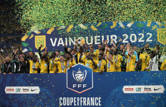 Nantes' players celebrate with the trophy after winning the French Cup final soccer match between Nice and Nantes at the Stade de France stadium, in Saint Denis, north of Paris, Saturday, May 7, 2022.