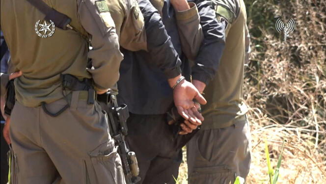 Screen capture from Israeli police video, showing the arrest of a Palestinian suspected of murder near Elad, Israel, May 8, 2022.