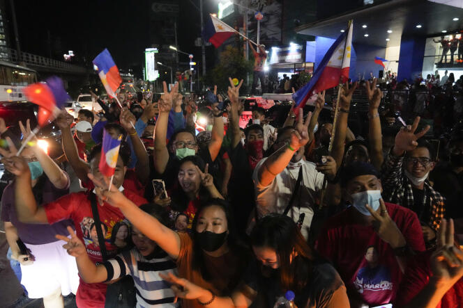 Supporters of Ferdinand Marcos Junior celebrate the election results at his headquarters in Mandaluyong on May 9, 2022. 