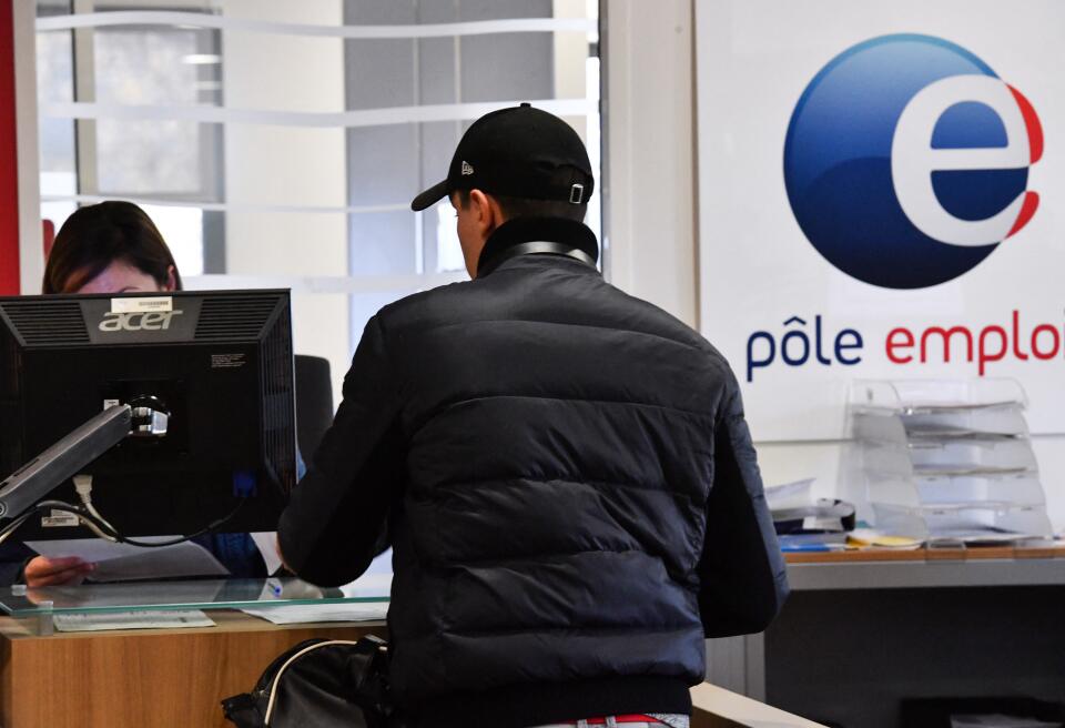 A man stands in a booth in a branch of France's national employment agency Pole Emploi in Montpellier, southern France on January 3, 2019. (Photo by PASCAL GUYOT / AFP)