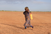 A girl carries a jerry can of water in the Higlo IDP camp in Ethiopia, April 27, 2022.