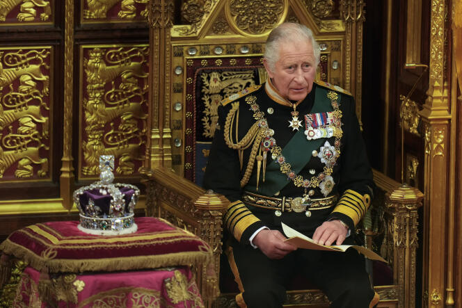 Prince Charles reads the Queen's speech next to her crown during the State Opening of Parliament, at the Palace of Westminster in London, Tuesday, May 10, 2022. 