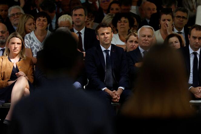 Mr. Macron and former Socialist Prime Minister Jean-Marc Ayrault (to his left), during a ceremony in Paris, May 10, 2022, marking the abolition of slavery.